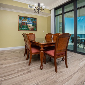 Gather around the elegant dining table to create lasting memories while enjoying coastal views
