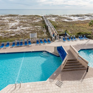Sparkling pool area views from your balcony and a scenic boardwalk leading directly to the beach