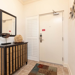 Step into this welcoming entryway featuring stylish decor, a decorative fish sculpture, and a cozy area rug