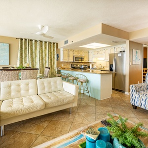 Cozy sectional invites you to relax with a good movie after snacks at the breakfast bar