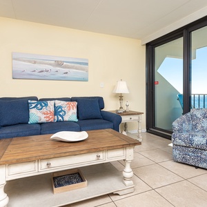 Relax in this inviting living room with stunning beachfront views, perfect for unwinding after a day of adventure