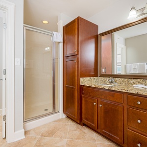 Experience a refreshing shower in this guest bathroom, surrounded by elegant details for a rejuvenating start to your day