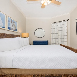 Relax on the cozy queen bed in this guest suite and stream your favorite shows after a beach day