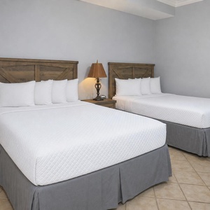 Relax on one of the cozy queen beds in this guest suite and enjoy a peaceful slumber