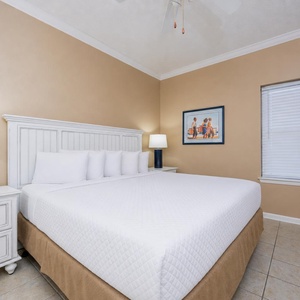 Your king  suite invites restful nights with soft pillows and gentle lamp glow nearby