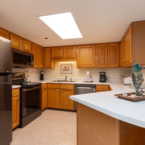 Inviting kitchen featuring ample counter space and stainless appliances for your convenience