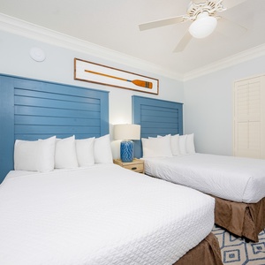 Two plush queen beds invite you to rest deeply in this guest suite after a day of coastal adventures