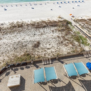 Enjoy the inviting outdoor pool area with shaded seating and easy access to the beach for sun-filled days of relaxation