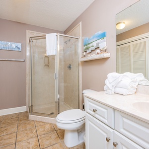 Refresh in this additional guest bath with a walk-in shower and laundry area with a washer and dryer in your rental