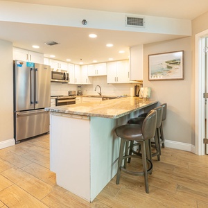 Sip your morning coffee at the counter, feeling the inviting vibe of your coastal retreat