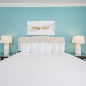Retreat to the king master suite with cozy bedding and drift off to coastal sights and sounds of the bay
