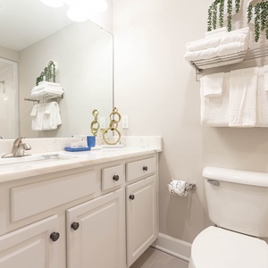 Freshen up in this guest bath in the relaxing shower or soothing tub before an exciting beach day
