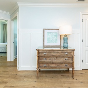 Step into a stylish entryway, where charming decor welcomes you to your coastal escape filled with comfort