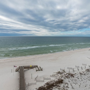 Enjoy the serene views from your balcony, overlooking the coastline stretching into the distance