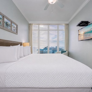A king guest suite welcomes you to rest after watching waves roll under a sky brushed with clouds