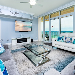 Relax on the cozy sofa with a queen sleeper in this inviting family room with breathtaking beachfront views