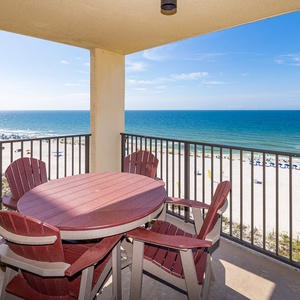 Relax on the balcony with a round table and Adirondack chairs, overlooking the beach and tranquil turquoise waters