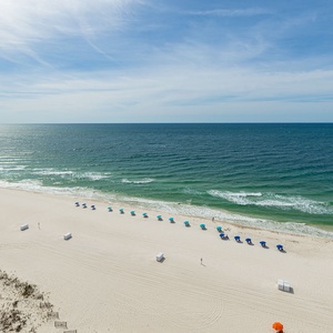 Experience the tranquility of soft sands and gentle waves, perfect for a relaxing day by the shore
