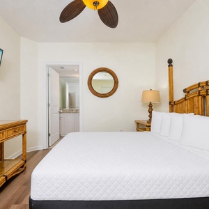 Drift off on the queen bed in the guest suite while soft sounds play on the mounted TV screen