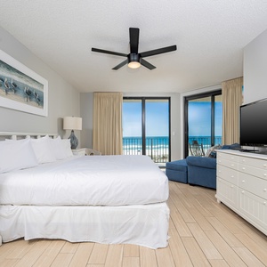 Unwind in the spacious master bedroom with a comfortable king bed, coastal decor, and stunning beach views