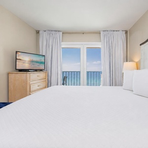 Bright morning sky frames your view from the king bed in the master suite as you stream your favorite show