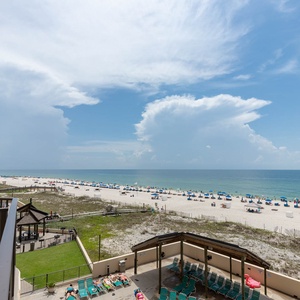 Enjoy breathtaking views of the beach from this extended spacious balcony, perfect for relaxation and soaking up the sun
