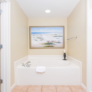 Indulge in relaxation in the master bath with a refreshing walk-in shower and soothing jetted tub