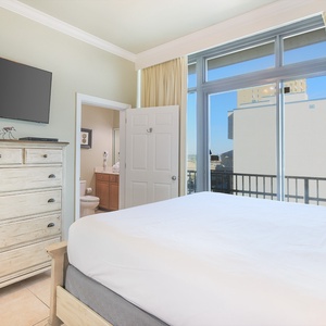 Relax on the cozy king bed in this guest suite and stream your favorite shows after a beach day