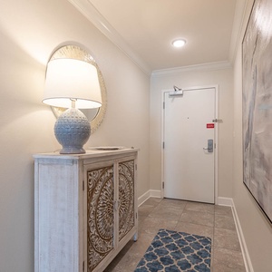 Step inside to discover a serene entryway, inviting you to start your beach getaway with stylish decor