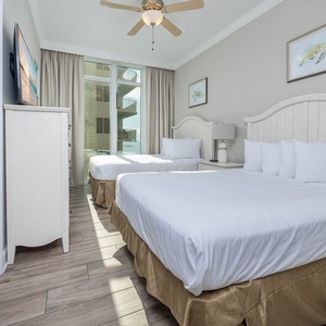 Relax in this queen guest suite, where soft bedding awaits for restful nights and coastal views
