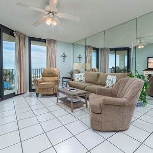 Unwind in the plush seating, with coastal views filling the room and a perfect spot for family movie nights