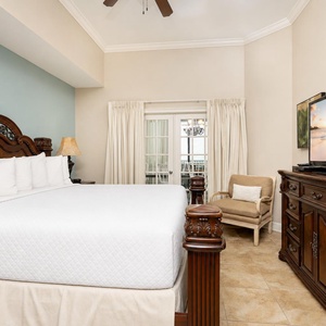 Experience restful nights in the plush king bed, with a soothing vibe enhanced by natural light streaming through the doors