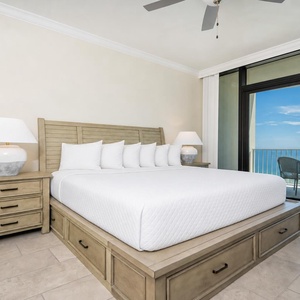 Relax in this inviting king master suite after a day of adventure and drift off on the beach