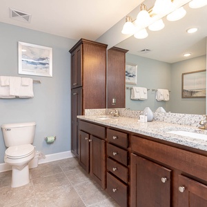 Refresh and rejuvenate in the master bath, featuring a relaxing jetted tub and soothing walk-in shower