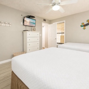 Settle in on the plush double beds in the guest suite, streaming your favorite shows while enjoying a vibrant beach vibe