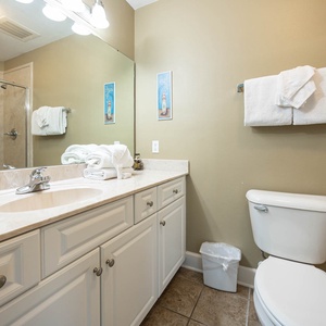 Indulge in refreshing moments in this guest bath with a spacious walk-in shower, surrounded by plush towels