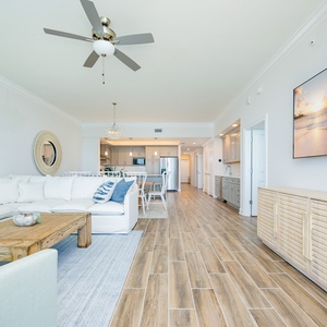 Relax on the spacious sectional sofa, with a stylish TV and inviting decor creating a welcoming coastal vibe