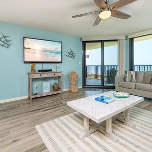 The living room invites you to unwind on the sofa queen while enjoying gulf views from your balcony doors