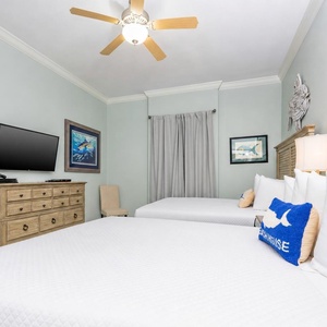 Sleep soundly in this guest bedroom, where plush queen beds promote restful nights and refreshed mornings