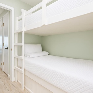 This cozy bunk area is perfect for kids to relax after beach adventures