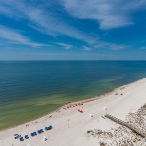 Experience seemingly endless coastline views of the horizon as waves lap the shore and the sun glistens over the water