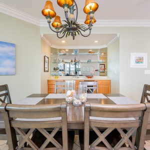 Gather around the dining table, sharing laughter and stories while enjoying the inviting atmosphere