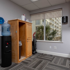 The fitness center at Seawind provides a water station and essentials for a clean and hydrated workout experience