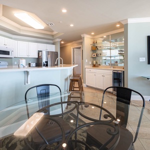Sip your morning coffee at the breakfast bar and get ready for a beach day in this stylish space