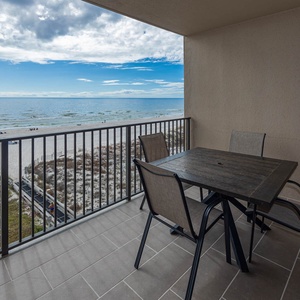 Enjoy meals or drinks at the outdoor table while taking in the beautiful views of the water and beach