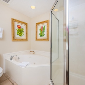 Indulge in relaxation in the master bath with a refreshing walk-in shower and soothing jetted tub