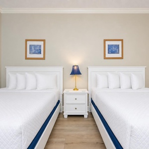 Relax on one of the cozy queen beds in this guest suite and enjoy a peaceful slumber