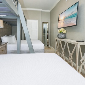 Perfect for families, custom built-in bunks with queen below and oversized twin above, plus flat screen tv for relaxing after a day at the beach