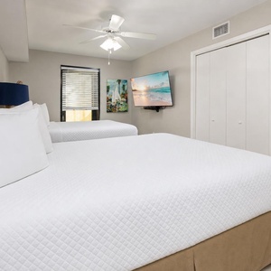Rest easy in the guest suite with plush queen bedding and a TV for family downtime