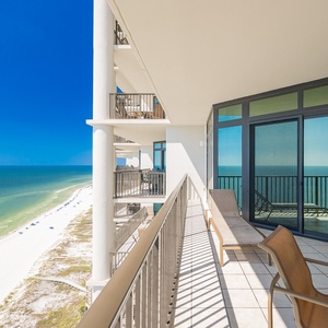 Breathtaking coastal views from the spacious balcony, perfect for relaxing in the sun or enjoying evening sunsets